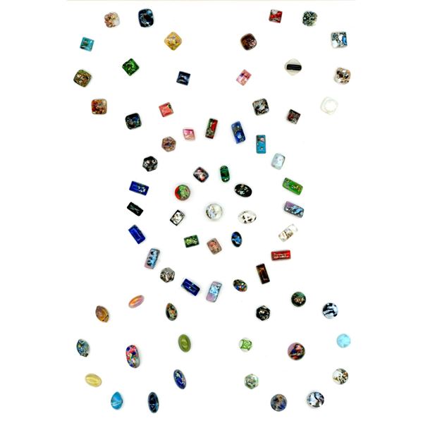 A card of division one foil imbedded glass buttons