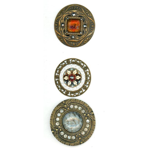 A small card of glass in metal buttons