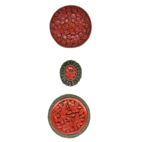 A small card of division one Cinnabar buttons