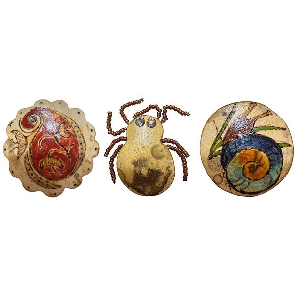 A small card of division three studio artist buttons