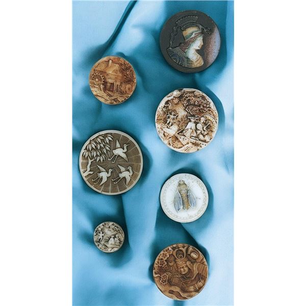 A small card of assorted division one glass buttons