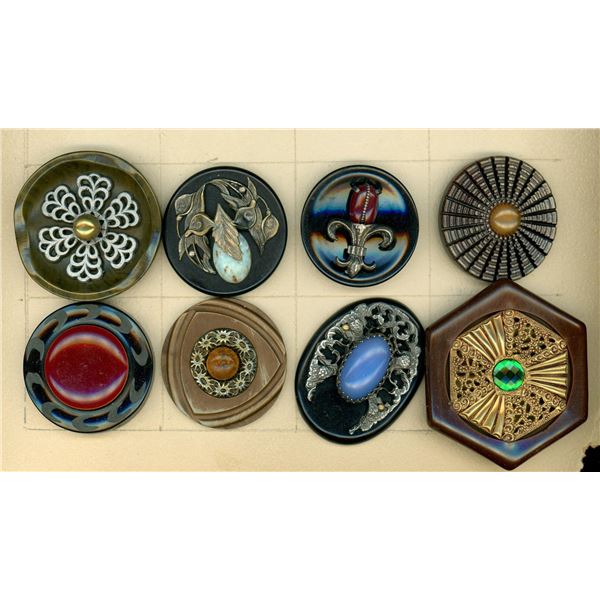 A partial card of division three Bakelite buttons