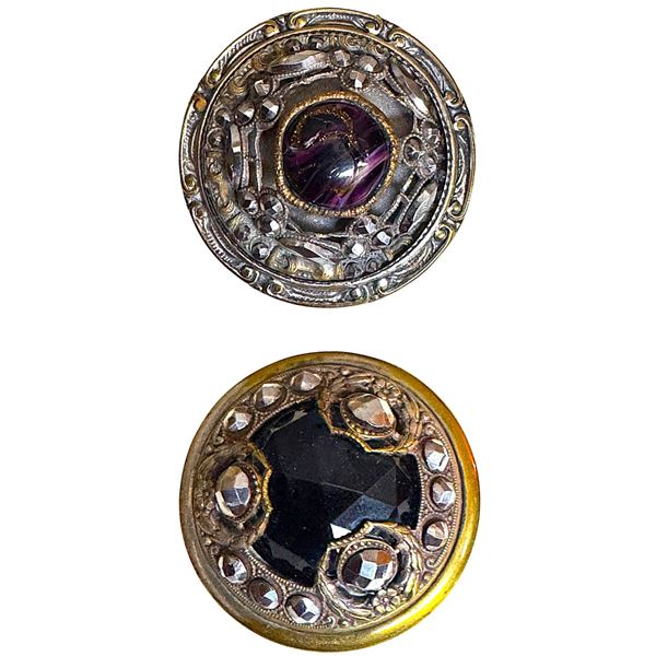 A small card of division one glass in metal buttons