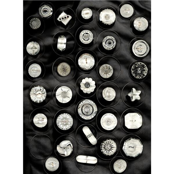 A card of division three clear glass buttons