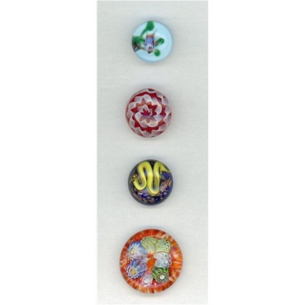 A small card of division three studio artist buttons