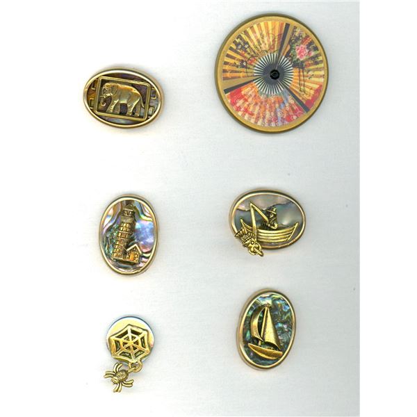 A small card of division three studio artist buttons.
