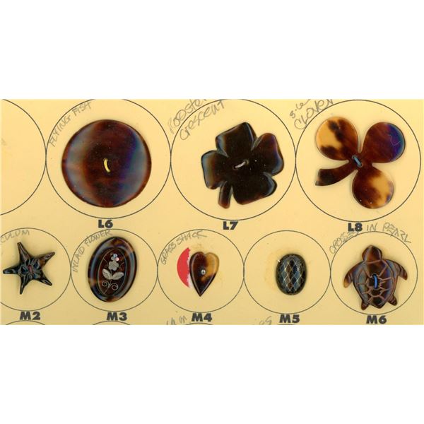 A small card of division one & three shell buttons