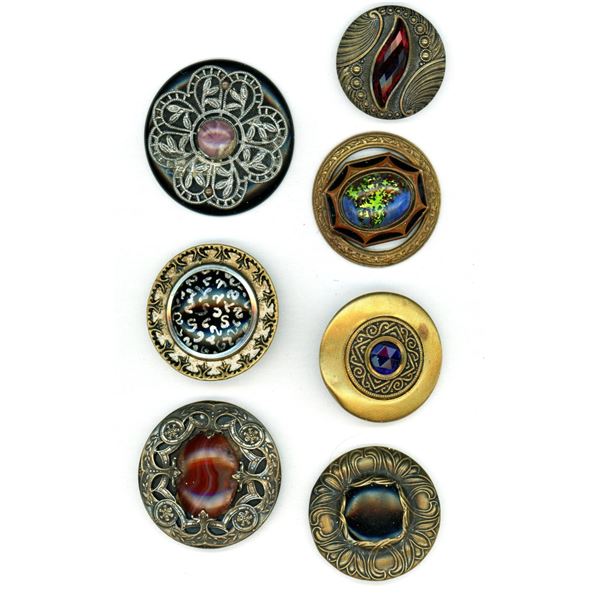A small card of glass in metal buttons