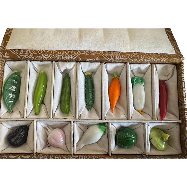 An original box set of handcrafted glass buttons