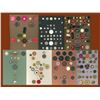 Image 1 : A box lot of assorted plastic carded buttons