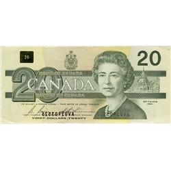 ERROR NOTE. 1991 $20 BC-58b-i  AVU2903526. Serial numbers are OFFSET. The face of the note shows a m
