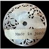 Image 2 : A division three carved and pierced pearl button.