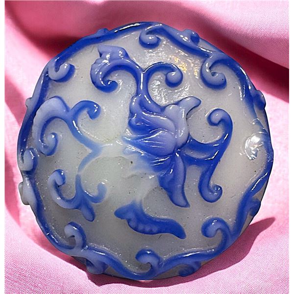 A division three hand crafted glass button