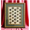 Image 2 : A framed card of division one celluloid buttons