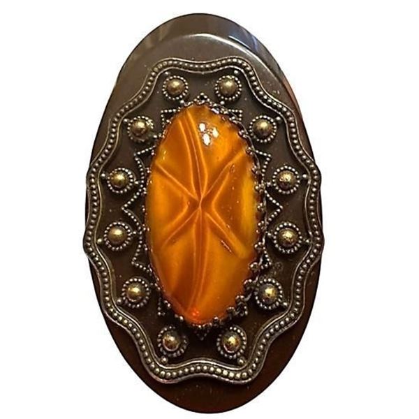 A division three Bakelite and glass button