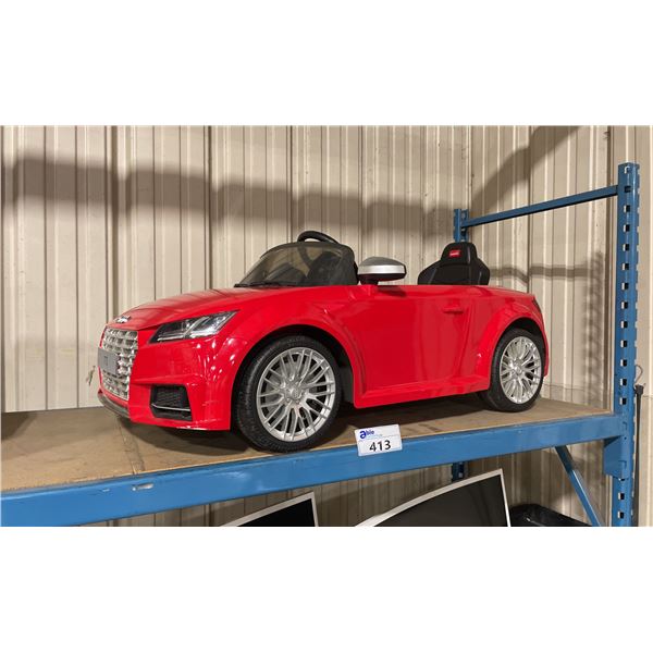 AUDI TTS RED ELECTRIC REMOTE CONTROLLED CHILDRENS RIDING VEHICLE WITH POWER ADAPTER & REMOTE