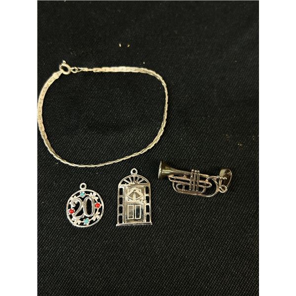 Lot of Sterling Silver Bracelet and 3 Charms, total weight 11 grams.