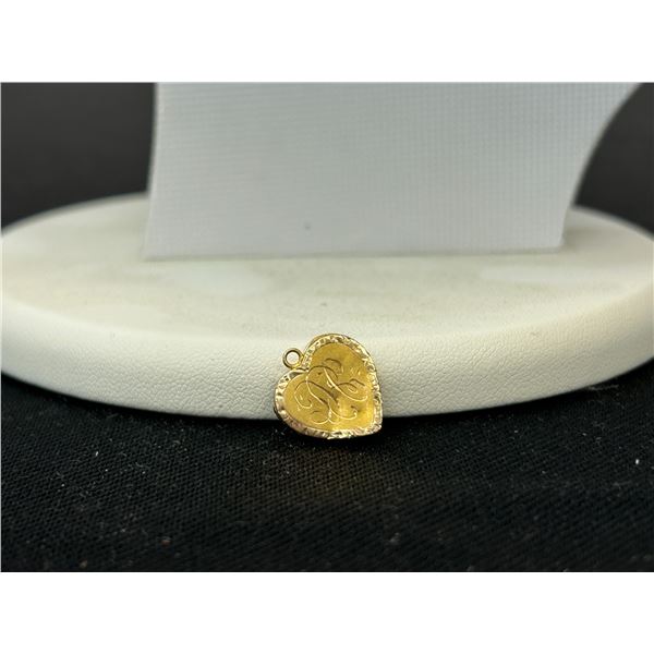 14k Yellow Gold Heart Shaped Locket 1.2 grams ( has some dents )
