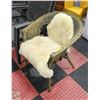 Image 1 : WICKER PATIO / ACCENT CHAIR WITH SHEEP SKIN RUG
