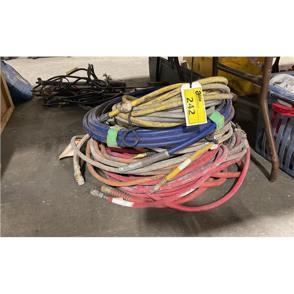 STACK OF ASSORTED INDUSTRIAL AIR HOSES