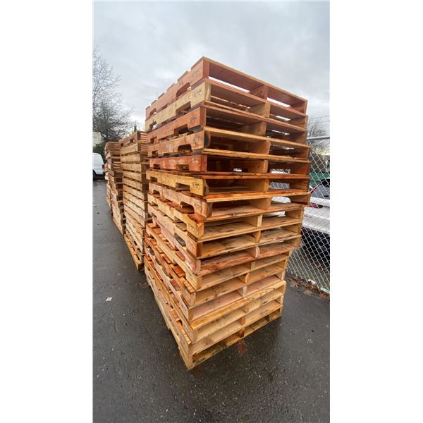 STACK OF APPROX 20 INDUSTRIAL WOODEN PALLETS