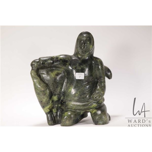 Hand carved Inuit soapstone of an hunter with seal, 11 1/2" in height
