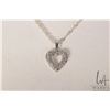 Image 2 : Birks 14kt white gold and diamond heart shaped pendant on 18" sterling silver twisted rope chair