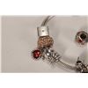 Image 2 : Genuine Pandora bracelet with twelve Pandora charms including dice, enameled Christmas pudding, cham