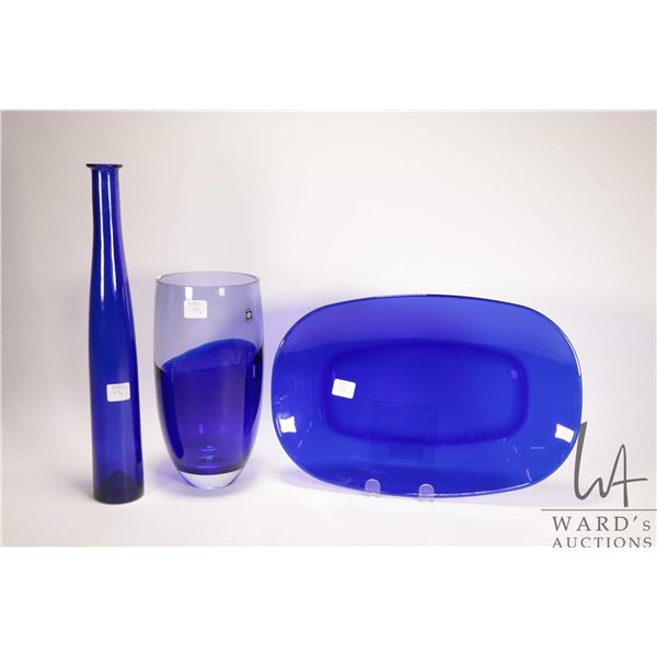 Three pieces of Polish cobalt crystal including 10" vase, 14" oval plate and a 14 1/2" bottle shaped
