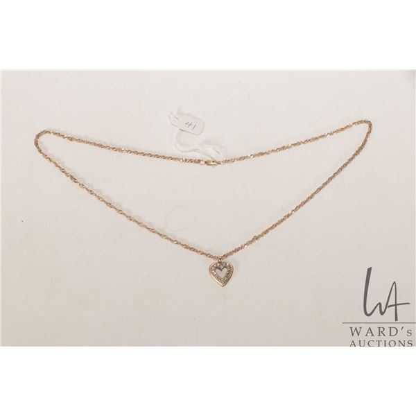 14kt yellow gold heart pendant set with diamonds on a 10kt yellow gold 19" neck chain