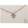 Image 2 : 14kt yellow gold heart pendant set with diamonds on a 10kt yellow gold 19" neck chain