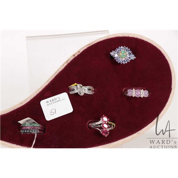 Seven sterling silver rings including set of three stacking rings, all with electronically tested ge