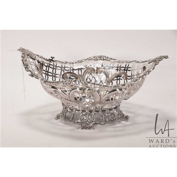 Antique sterling silver pierced basket with British hallmarks indicating makers date of 1888, London