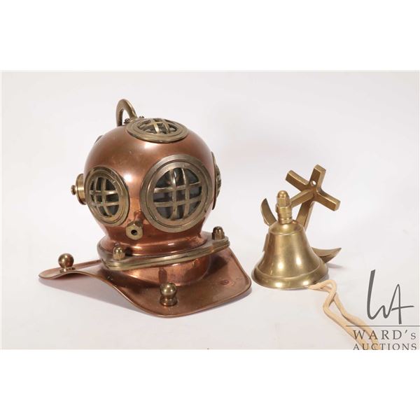 Miniature brass and 6 1/2" copper diving helmet and a brass wall mount, anchor motif bell