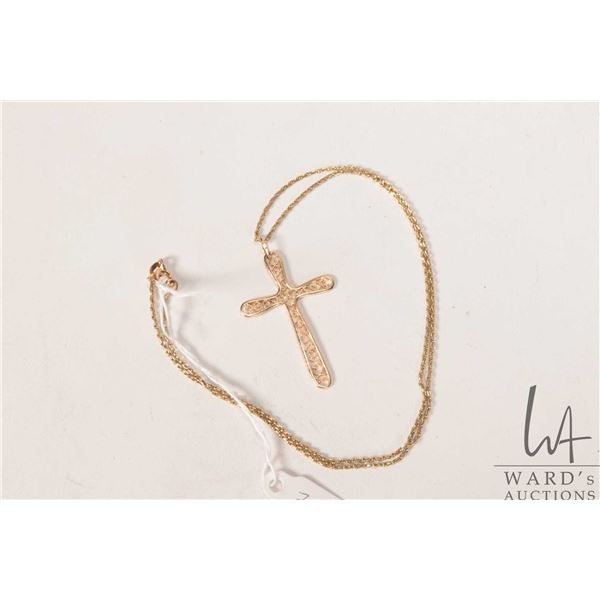 10kt yellow gold 16" neck chain with a 10kt yellow gold filigree cross pendant