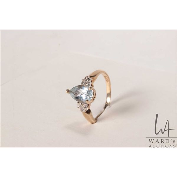 10kt yellow gold and pear shaped aqua gemstone ring set with small accent diamonds, size 6.75
