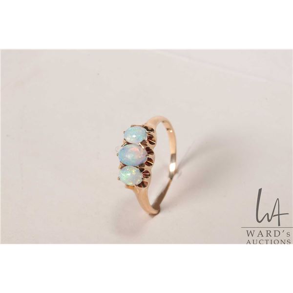 Vintage 14kt yellow gold ring set with three opals, size 6.5