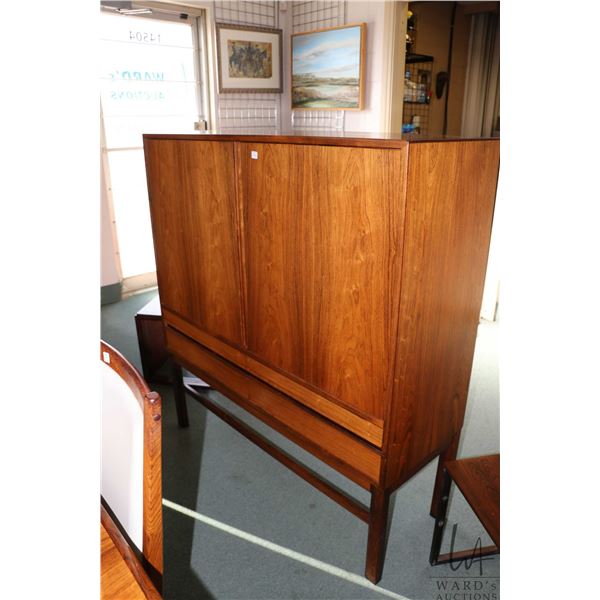 Midcentury modern two door with four drawer chest, left drawer opens to expose five pull out trays, 