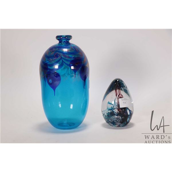 Two pieces of Martha Henry art glass including 7 1/2" vase dated '80 and a 4" paperweight dated '86