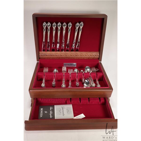 Wooden canteen containing settings for eight of Oneida silverplate flatware including dinner knives,