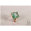 Image 1 : 10kt yellow gold ring set with green emerald cut gemstone, size 6.25