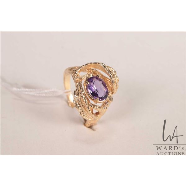 14kt yellow gold ring set with oval amethyst gemstone, size 7.25