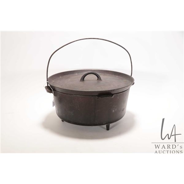 Griswold No. 10 footed cast iron Dutch oven with lid