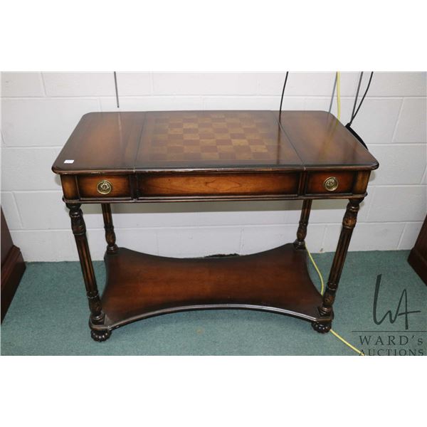 Semi contemporary games table with two storage drawers and flip over center section to expose backga