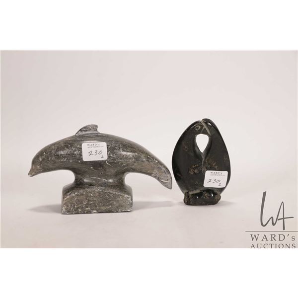 Two hand carved Inuit soapstones including 6" long dolphin, signed by artist in syllabics and a pair