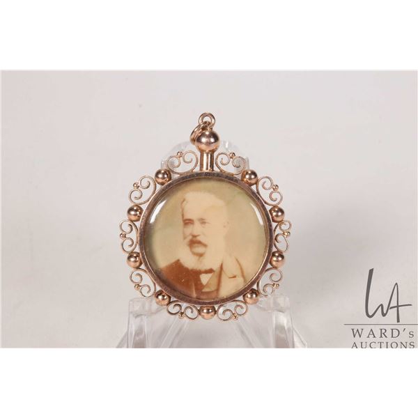 Antique tested 10kt yellow gold double sided pendant with antique photographs