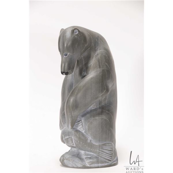 Hand carved Inuit soapstone bear with fish, 8 1/2" in height, signed by artist in syllabics, numbere