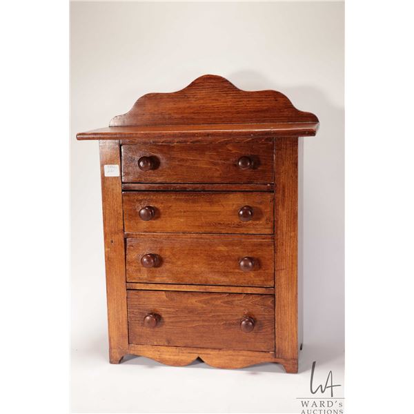 Antique miniature table top dresser with four drawers and original hardware, 19" including backboard
