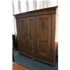 Image 1 : Large three door and three drawer European storage cabinet with carved raised panels, bun feet and m