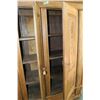 Image 2 : Large three door and three drawer European storage cabinet with carved raised panels, bun feet and m